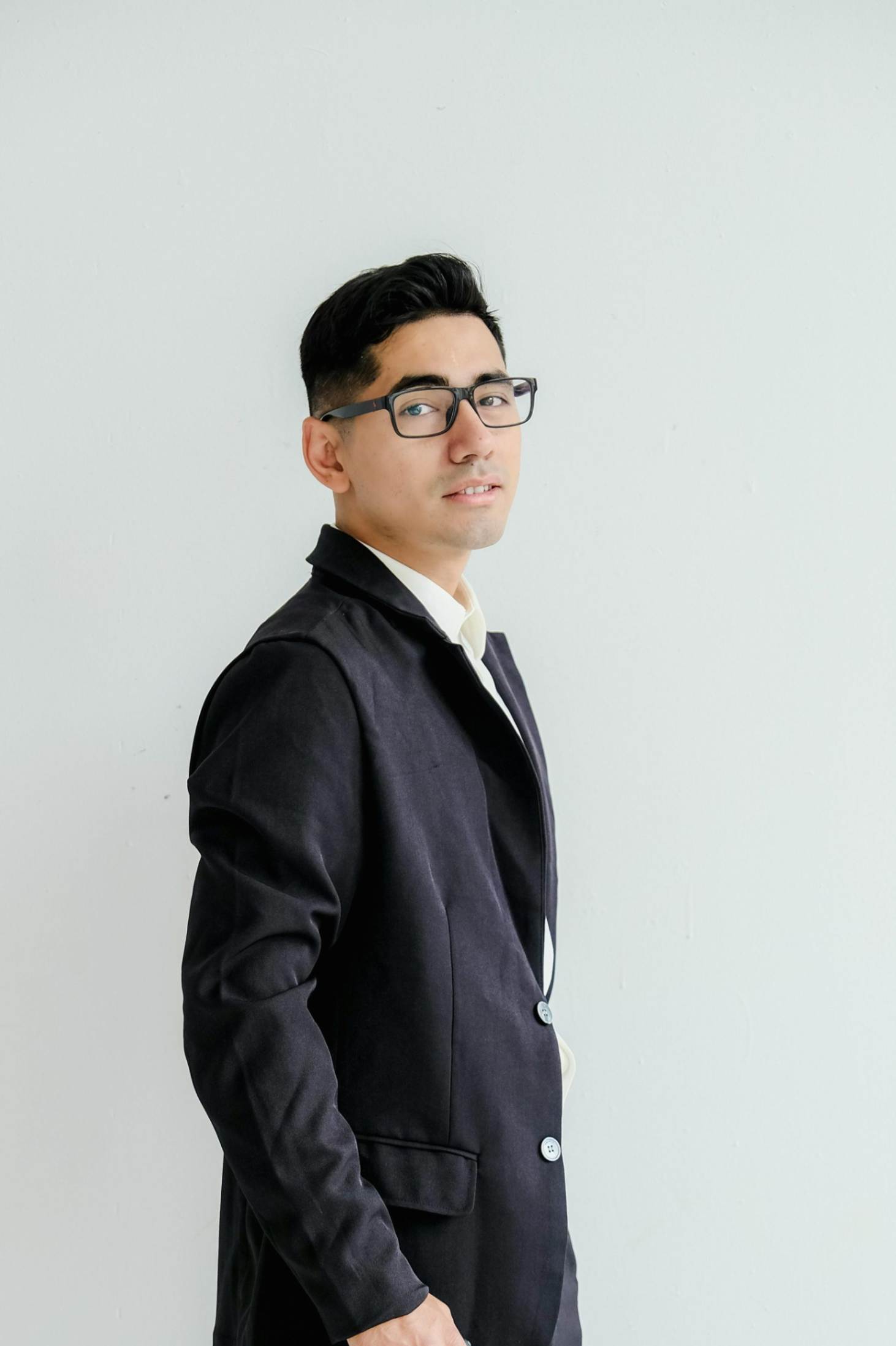 Male customer standing in a suit giving a positive review