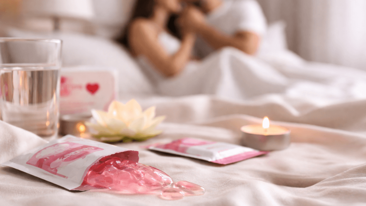 Lovegra oral jelly sachets on a bedside table with a water glass, representing off-label use for women.